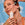 Woman applying Sun Serum drops SPF 30 on her face showing how easy and convenient is the application of this formula